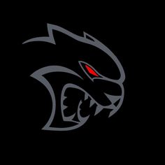 the black panther logo with red eyes on it's head and fangs in its mouth