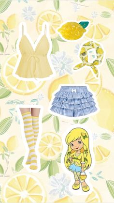 the paper doll is next to some lemons and other things on it's surface