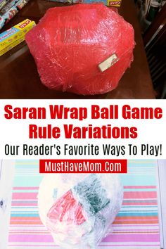 a red ball sitting on top of a table next to a pile of plastic wrap