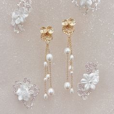 two pairs of earrings with pearls and flowers