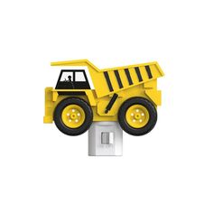 a yellow toy dump truck sitting on top of a white light switch cover with black wheels