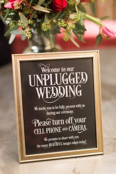 a sign that says welcome to our unplugged wedding on the side of a table