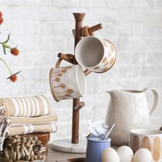 coffee mugs and other kitchen items on a table