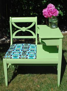 a green chair with a flower pot on top of it