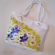 ♥Violets and Daisies Bag, Hadpainted Summer Bag, Floarl Bag, Violets Handbag, Daisies Summer Bag, Handpainted Flowers Bag, Hand Painted Bag♥ HAND PAINTED HANDBAG by DiqnaDesign. ------- SIZE & DETAILS ------- Unique handpainted product Professionally hand-painted with lots of love. Measures: 30 x 39 cm ≈ 11.8 x 15.3 inches, This bag is fastened with a zipper. There are no internal divisions. Material: Eco Leather All bags are hand painted with professional textile paint Because these are Ori White Bucket Shoulder Bag As A Gift, Artistic Tote Bags For Spring, Artistic Spring Tote Bag, Artistic Hand Painted Shoulder Bag For Gift, Artistic Hand Painted Shoulder Bag Gift, Hand Painted Tote Shoulder Bag For Gift, Artistic White Bags For Daily Use, Artistic White Bag For Daily Use, Hand Painted White Tote Shoulder Bag