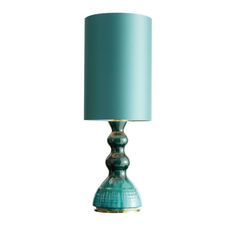 a green lamp with a blue shade on it's base and a white background