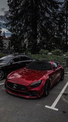 two red sports cars parked in a parking lot