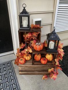 some pumpkins and candles are sitting on the steps