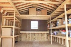 the inside of a storage room with shelves and boxes