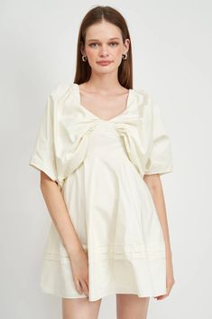 Crafted with luxurious 100% cotton poplin, this off white mini dress by EN SAISON is sure to make a statement. Fully lined with hidden underwire at the bust and pleated trim at the hem, the classic sweetheart neckline is framed by the elegant butterfly-style wide sleeves. A hidden zipper at the back completes the look. **Sizing notes: Model is 5'9 and wears size small XS (0-2) S (2-4) M (6-8) L (10) MATERIALS: 100% Cotton // Lining: 100% Cotton CARE: Hand wash Outfit Minimal, Butterfly Style, Grad Dresses, Virtual Closet, Wide Sleeves, A Frame, Dress 100, White Mini Dress, Curator Style