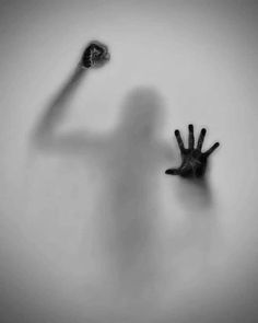 the shadow of a person's hand is shown in front of a white background