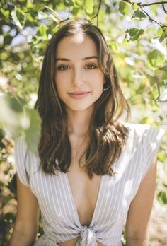 a young woman is posing for a photo