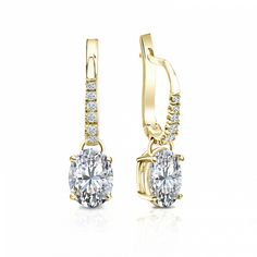 Dangle studs 4-prong basket set diamond earrings make an elegant statement for any occasion. These 14k yellow gold earrings can last a lifetime. The earrings feature oval-cut natural diamonds with 1.50 ct. total weight for center stone and with 0.10 ct. total weight of small dazzling round-cut diamonds as side stone totaling to 1.60 ct. in a complete pair, available in lever back clasps. Black Diamond Pendant, Black Diamond Studs, Halo Diamond Earrings, Solitaire Diamond Pendant, Colored Diamond Rings, Basket Setting, Basket Set, Black Diamond Ring, Gemstone Studs