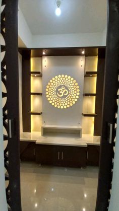 a large mirror reflecting the inside of a room with a buddha symbol on it's wall