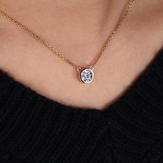 This stunning IGI-certified round lab grown solitaire diamond necklace will make a perfect gift for the special woman in your life. The bezel setting showcases the beautiful diamond, and the IGI certification guarantees that it is high quality and authentic. This diamond necklace will last a lifetime and make her feel special. "𝐓𝐨𝐠𝐞𝐭𝐡𝐞𝐫 𝐰𝐞 𝐜𝐚𝐧 𝐦𝐚𝐤𝐞 𝐭𝐡𝐞 𝐰𝐨𝐫𝐥𝐝 𝐚 𝐛𝐞𝐭𝐭𝐞𝐫 𝐩𝐥𝐚𝐜𝐞 𝐟𝐨𝐫 𝐥𝐢𝐯𝐢𝐧𝐠, 𝐥𝐞𝐭’𝐬 𝐠𝐨 𝐰𝐢𝐭𝐡 𝐦𝐢𝐧𝐢𝐧𝐠-𝐟𝐫𝐞𝐞 𝐝𝐢𝐚𝐦𝐨𝐧𝐝𝐬 𝐚? Luxury Solitaire Necklace With Delicate Round Cut, Round Necklace With Bezel Setting, Elegant Round Cut Diamond Necklace For Everyday Luxury, Minimalist Solitaire Necklace With Tension Setting, Solitaire Lab Grown Diamond Necklace, Luxury Round Solitaire Necklace With Lab Grown Diamond, Dazzling Round Cut Solitaire Necklace With Lab Grown Diamond, Moissanite Solitaire Necklace With Round Stone, Solitaire Necklace Gift With Round Pendant Tension Setting