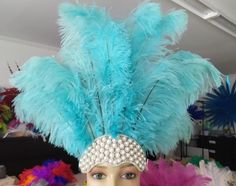 Feathers  Headdress  10 "  to 13" long  floss Feathers NEW STYLE 2025 Collection Tiara Crown  Pearls Clear Crystal Headdress Carnival Headdress Mardi Gras New Orleans Mardi Grass Parade Vegas Show Hora Loca   New Carnival Silver  Base and Pearls made with Ostrich Floss feathers  Headdress size 13" tall 18" wide (feathers and crown) approximately  Secures firmly with a 1" glitter elastic band extremely light and easy to wear Carnival Feather Headdress- Ostrich floss feathers on a Silver Rhinestone crown Samba Headdress hora loca parade Ostrich Feathers are a natural product, each one is different and some variance, in color, length and texture should be expected. The feathers we use are hand selected to make each feather piece. The same style of feather pieces may have a different amount of Carnival Headdress, Mardi Gras New Orleans, Gold Headpiece, Pearl Tiara, Feather Headdress, Rhinestone Crown, Tiara Crown, Open Face, Colorful Feathers