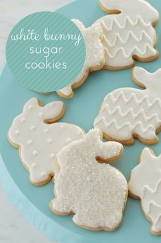 white bunny sugar cookies on a blue plate with the words, white bunny sugar cookies