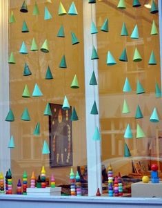 a window with many different colored toys in it