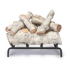 logs stacked on top of each other in front of a white background with black legs