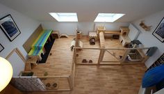 an overhead view of a bedroom and living room in a house with wood flooring