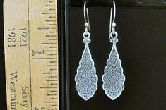 "Beautiful, embossed Art Nouveau design earrings. Dramatic Beauty...these can be worn every day to Wedding day! Ornate Art Deco design, Antiqued Silver Plated Dangle Earrings. Lots of detail in the design. Earrings drop 1-1/8\" below the ear wires. Hook Ear wires will be the coil wrapped wires, as in the some of the photos. Sent to you with Aloha! 158" Engraved Drop Earrings For Wedding, Engraved Dangle Earrings For Wedding, Elegant Engraved Metal Earrings, Earrings Dramatic, Victorian Cosplay, Art Nouveau Earrings, Art Nouveau Earring, Black Minimal, Buy Earrings