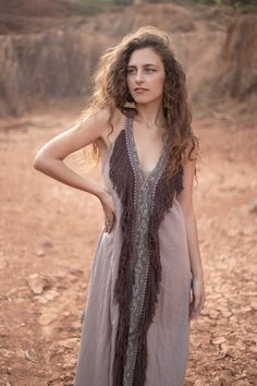 The Bedouin Dress is made of hand loomed raw silk and features an open back with adjustable straps that enable you to find your preferred neckline depth and a drawstring at the seam line of the open back to raise it lower backline. Size | One Size AUS 6 - 12 UK 6 - 12 US 2 - 8 EU 34 - 40 See last pic for size chart Fabric | Hand loomed raw silk Featuring raw silk fringing Featuring hand block printed trim detail Care | Dry clean only Or Hang in soft sunlight or breeze to freshen. Bohemian Sleeveless Maxi Dress With Back Tassel Tie-up, Summer Festival Dresses With Back Tassel Tie-up, V-neck Boho Dress With Tassels For Festival, Long Bohemian Dress With Back Tassel Tie-up, Bohemian V-neck Fringe Dress, Summer V-neck Dress With Fringe, Free-spirited V-neck Maxi Dress For Festival, Spring Beachwear Maxi Dress With Fringe, Free-spirited Boho Maxi Dress For Festival