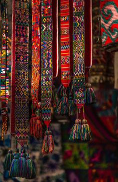 many colorful tassels hanging from the ceiling