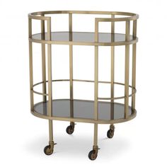 a round metal and glass table with wheels on the bottom, one shelf is empty