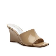 Marc Fisher-Rollo Wedge Sandal The Marc Fisher Rollo wedge sandals are a must-have for the warm weather season. Featuring a high heel, a thick strap, and a square toe, this patent pair is sure to make a statement.