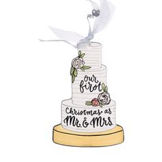 a wedding cake with the words our first christmas as mr and mrs