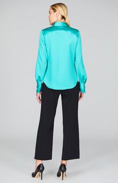 Our signature collared button down shirt is an elegant update to a wardrobe staple. Cut with a beautifully drapey and relaxed sleeve and finished with a wide angled cuff that can be worn long or folded up for maximum versatility. An easy way to add a pop of color and shine under a jacket, but strong enough to stand alone. Elegant Spread Collar Blouse For Fall, Elegant Blouse With Spread Collar For Fall, Elegant Shirt With Shirttail Hem For Spring, Chic Silk Shirt With Hidden Button Closure, Modern Formal Tops With Shirttail Hem, Modern Formal Top With Shirttail Hem, Elegant Blouse With Spread Collar And Button Cuffs, Elegant Fall Shirt With Concealed Placket, Versatile Formal Blouse With Button Closure