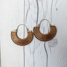 Crescent Hoop Earrings | Boho Earrings | Thread Wrapped Earrings | Boho Jewelry | Half Circle Hoop Earrings | Statement Earrings A a thread wrapped half circle hoop. The thread comes in black, gray, or light tan. Length: 21 1/2 inches Width: 2 inches S O C I A L * M E D I A Follow us on Instagram: https://www.instagram.com/_andkatedesigns/ Y O U * M A Y * A L S O * L I K E To See Our Entire Shop: https://www.etsy.com/shop/andKateDesigns Everyday Handmade Metal Hoop Earrings, Summer Hoop Earrings With Ear Wire, Brown Hoop Earrings Gift, Small Metal Hoop Earrings For Summer, Handmade Brown Hoop Earrings For Everyday Wear, Small Hoop Earrings For Festival, Brown Hoop Single Earring, Brown Metal Earrings For Festival, Everyday Handmade Brown Hoop Earrings