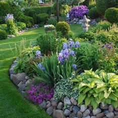 a garden filled with lots of different types of flowers