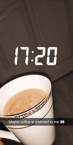 a coffee cup with the time displayed on it