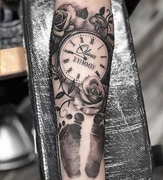 an arm with a clock and flowers on it