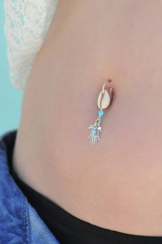 "A feminine and delicate Hamsa belly button ring made with dangling Swarovski crystal beads. This navel piercing is handmade of a 14k gold filled or Silver hoop, Hamsa hand pendant, Cowrie shell pendant, and blue Opal stones. The Hamsa (or Hand of Fatima) is a middle-eastern symbol of good luck, said to keep evil spirits away. Wear it or give it to a loved one to use as an amulet to give protection and good luck. Do not hesitate to contact me for special requests and customization! ♥♥ In a hurry Dangle Belly Ring As Gift, Silver Dangle Belly Rings Nickel Free, Nickel-free Silver Dangle Belly Rings, Bohemian Silver Belly Rings Nickel Free, Sterling Silver Dangle Belly Rings For Gift, Dainty Nickel-free Belly Rings As Gift, Nickel Free Sterling Silver Dangle Belly Rings, Nickel-free Dangle Belly Rings In Sterling Silver, Nickel-free Sterling Silver Dangle Belly Rings