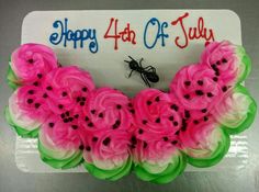 a birthday cake decorated with pink and green flowers