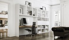 a living room filled with furniture and lots of bookshelves on top of it