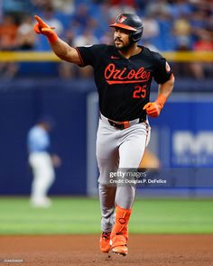 the baltimore orioles running to first base during a baseball game against the los angeles angels