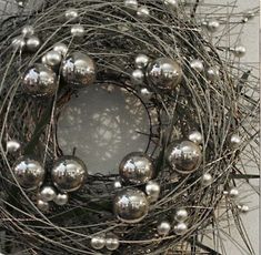 a close up of a metal ball wreath