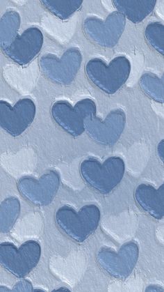 many blue hearts are arranged in the shape of heart shapes on a white background with light blue paint