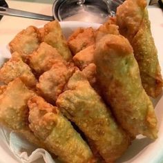 some fried food is on a white plate