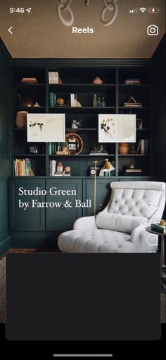 an image of a room with green walls and white chair in the center, surrounded by bookshelves