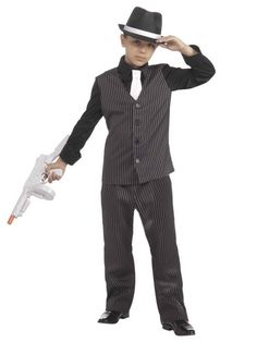 Pull off a grand heist in this 1920's Lil' Gangster Children's Costume. Hit the bank, grab all the cash, make a getaway, and live life on the run. Turn into some of the most notorious criminals from across the country. There are a number of real gang members you could portray thanks to this particular outfit like Al Capone, Machine Gun Kelly, and John Dillinger. Or try to look like characters from popular gangster films and television shows. You receive a pinstripe vest and matching pair of pant Gangster Fancy Dress, Gangster Suit, Gangster Costume, Gangster Costumes, 1920s Costume, Gangster Films, Boys Vest, Striped Vests, Vest And Tie