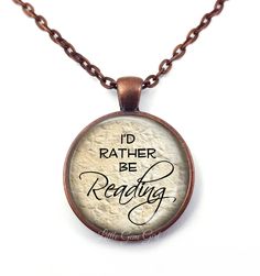 "I'd rather be Reading Necklace - Book Lover Necklace or Keychain - Bibliophile Pendant - Literary Jewelry for Author Writer Library Teacher \"I'd rather be Reading\" book jewelry necklace. A wonderful gift for Book Lovers, Teachers, Librarians, Literary Scholars, Writers and Authors, Book Clubs, etc! The pendant is 1 inch (25mm) in diameter. High quality vibrant colored image is fused to a thick glass bevel which gives a magnifying appearance that is truly lovely. Available in 5 setting colors: Personalized Bookish Necklace For Gift, Literary Jewelry, Lover Necklace, Customizable Jewelry, Moon Bracelet, Literary Gifts, Book Jewelry, Bronze Pendant, Moon Jewelry