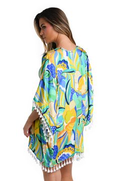 Radiate tropical energy with this vibrant marigold cover up adorned in a multi-colored tropical print, infusing your beach look with a burst of vivid hues reminiscent of sun-drenched paradises. It has a breezy, square cut design, a carefree open front and playful tassels on the sleeves and hem. While it's the perfect piece to pair with your suit, this chic cover-up also makes a stylish statement when layered with a casual outfit for sea-to-shore ease. [split] Details Kimono Cover Up Square, Rela Swimsuit Material, Sun Tan, Beach Look, Square Cut, Tropical Print, Cut Design, Dolman Sleeve, Sicily, Casual Outfit