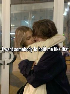 two people hugging each other with the caption i want somebody to hold me like that