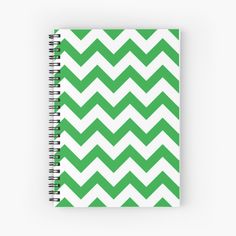 a green and white zigzag pattern spiral notebook