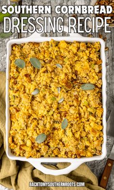 southern cornbread dressing recipe in a white casserole dish with sage leaves on top