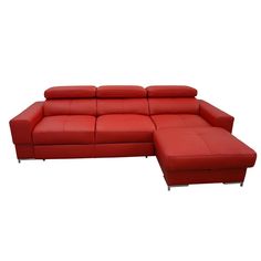 a red leather sectional sofa sitting on top of a white floor next to a footstool